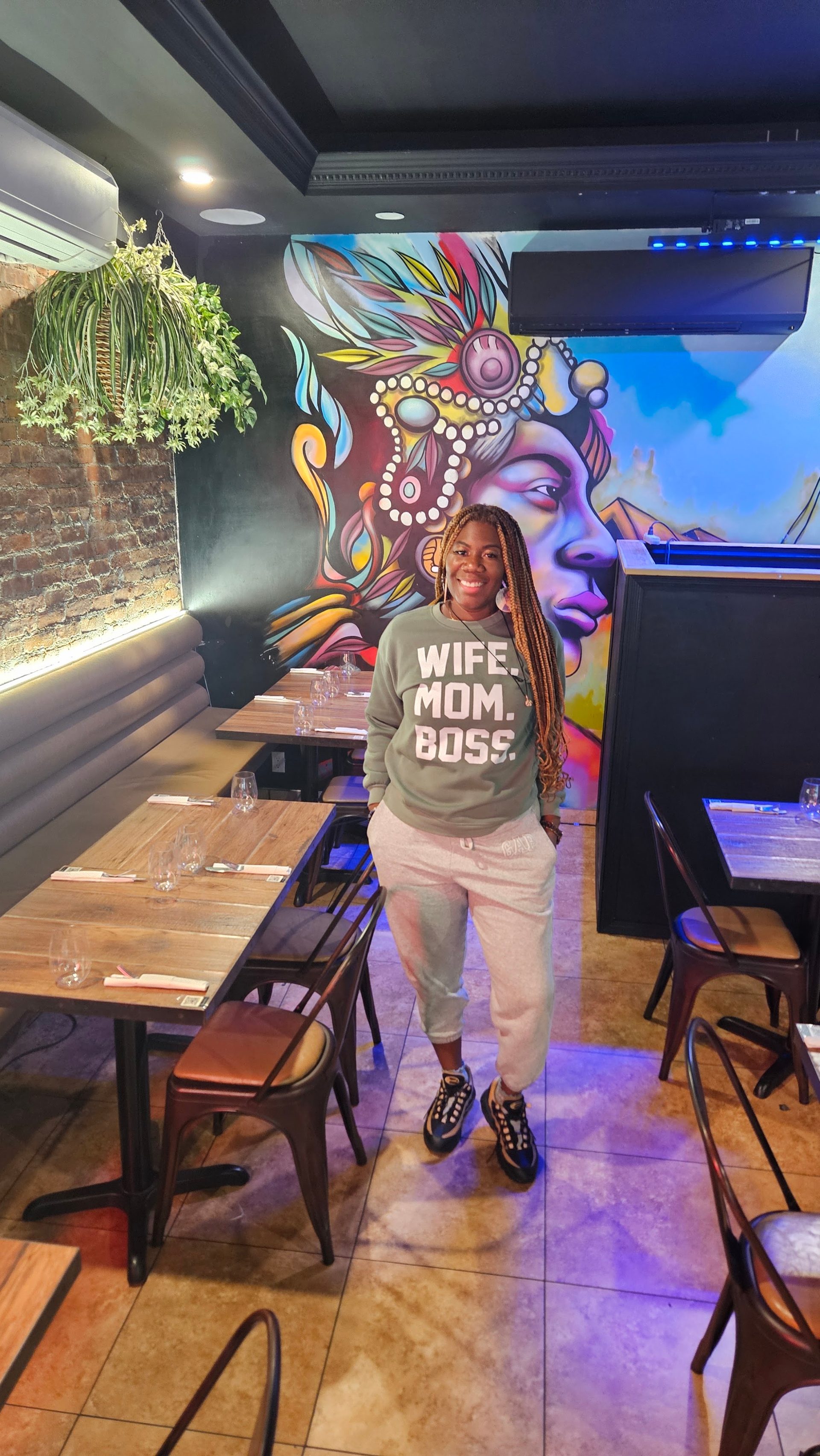 Murals, brick walls, and a warm bar